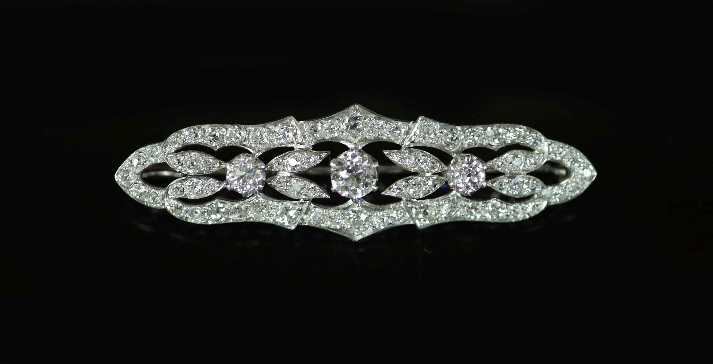 A mid 20th century pierced platinum and diamond cluster set brooch